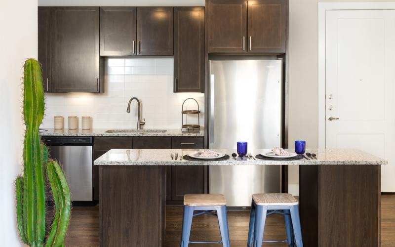 a kitchen with a table and chairs