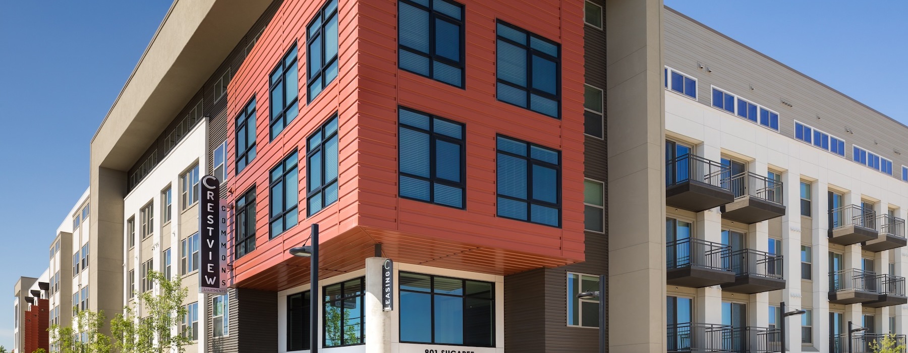 a multi-story building with a red and white exterior