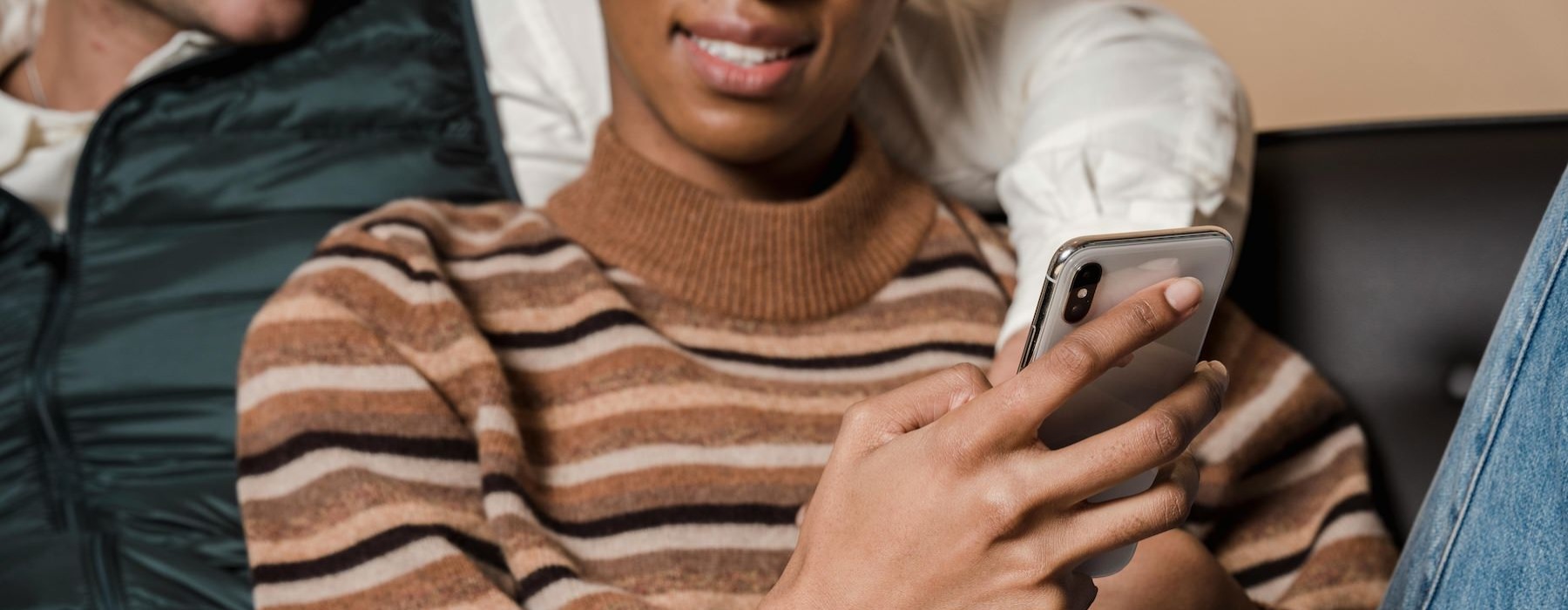 a couple looking at a phone
