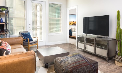 a living room with a tv and furniture